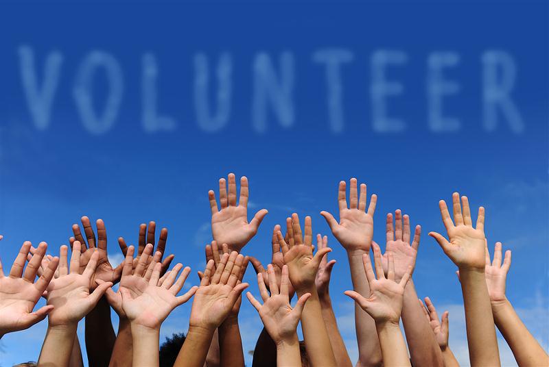 bigstock_volunteer_group_raising_hands__19543958